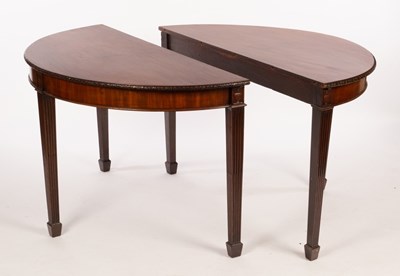 Lot 567 - A pair of mahogany side tables with carved...