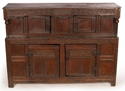 Lot 586 - An English oak press cupboard, the overhanging...