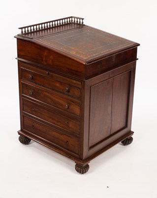 Lot 597 - A Regency rosewood Davenport desk in the...