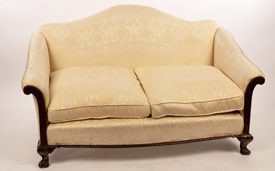 Lot 606 - An arch back two-seat sofa, the show wood...