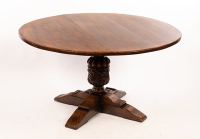 Lot 607 - An oak centre table on carved column and cross...