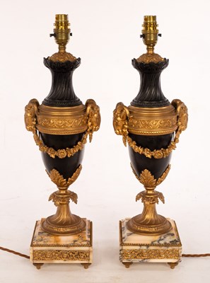 Lot 635 - A pair of urn-shaped table lamps with ram's...