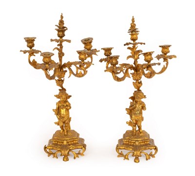 Lot 638 - A pair of gilt metal candelabra with...