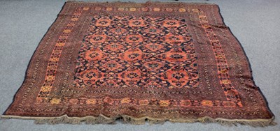 Lot 639 - A Turkoman rug with red ground geometric and...