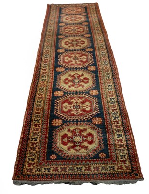 Lot 640 - A Hamadan runner, the central blue ground...