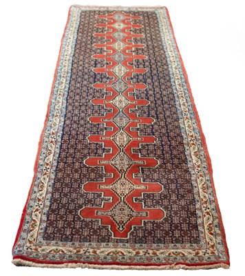 Lot 659 - A North West Persian Senneh runner, 387cm x 92cm