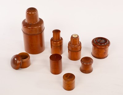 Lot 696 - A collection of five treen string boxes and...