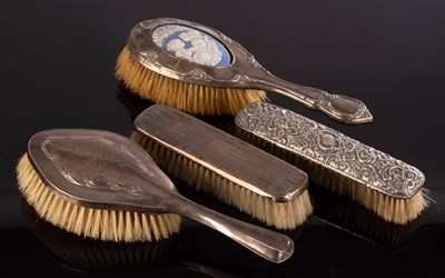 Lot 10 - A silver mounted dressing brush with a...