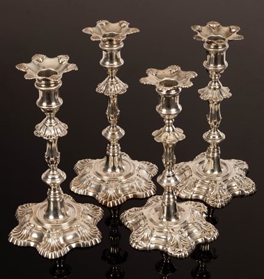 Lot 27 - A pair of George II cast silver candlesticks,...