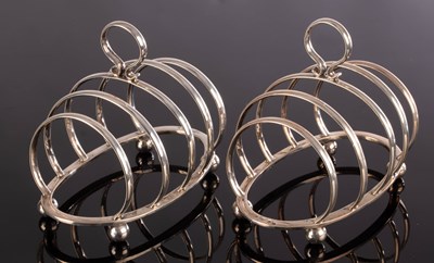 Lot 39 - A pair of silver toast racks, Goldsmiths &...