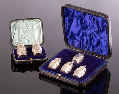 Lot 48 - A cased pair of silver pepper pots, EH, London...