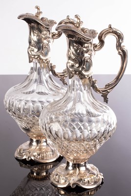 Lot 100 - A pair of silver plate mounted claret jugs,...