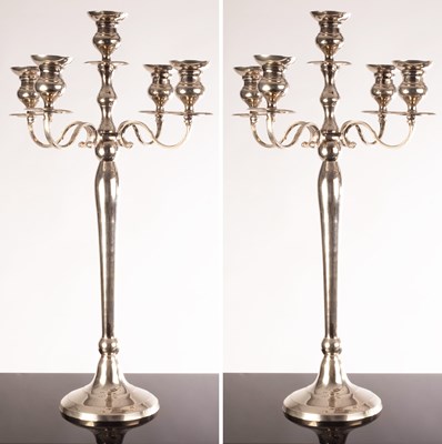 Lot 102 - A pair of plated four-branch candelabra, 77cm...