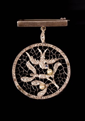 Lot 120 - A diamond and pearl pendant of openwork form...