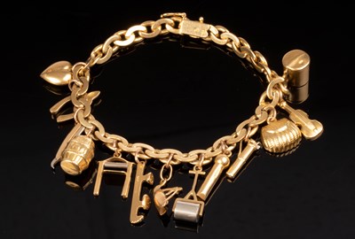 Lot 124 - An 18ct yellow gold charm bracelet, the curb...