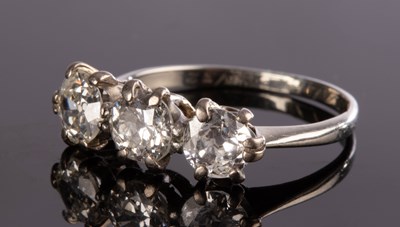 Lot 150 - A diamond three-stone ring, the central stone...