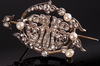 Lot 167 - A diamond and pearl brooch of openwork form,...