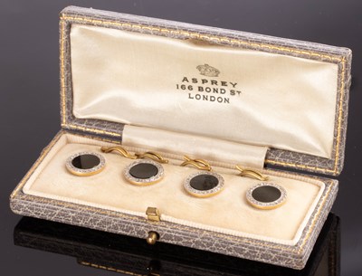 Lot 179 - A set of four onyx and diamond dress buttons,...