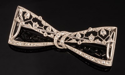 Lot 197 - A diamond set bow brooch of openwork form, 5cm...