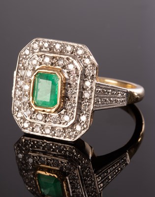 Lot 212 - An emerald and diamond cluster ring, the...