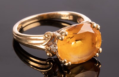 Lot 217 - A citrine and diamond dress ring, the oval...