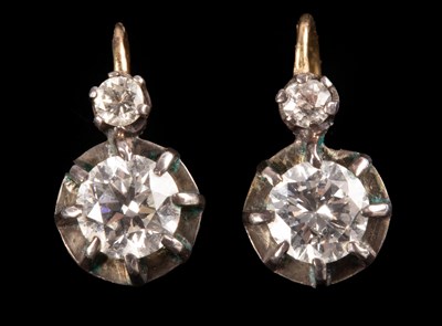 Lot 218 - A pair of diamond earrings, each set with two...