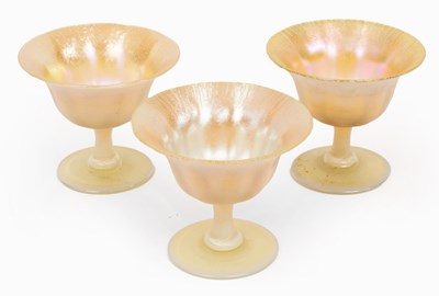 Lot 249 - Three Tiffany favrile footed bowls, with...