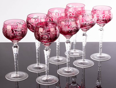 Lot 258 - A set of eight wine glasses, the ruby coloured...