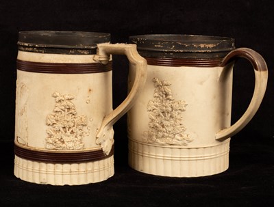 Lot 270 - Two English white stoneware tankards decorated...