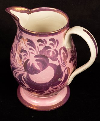 Lot 276 - An English pink lustre baluster jug with...