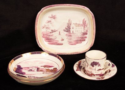 Lot 280 - A purple lustre coffee can and saucer, two...