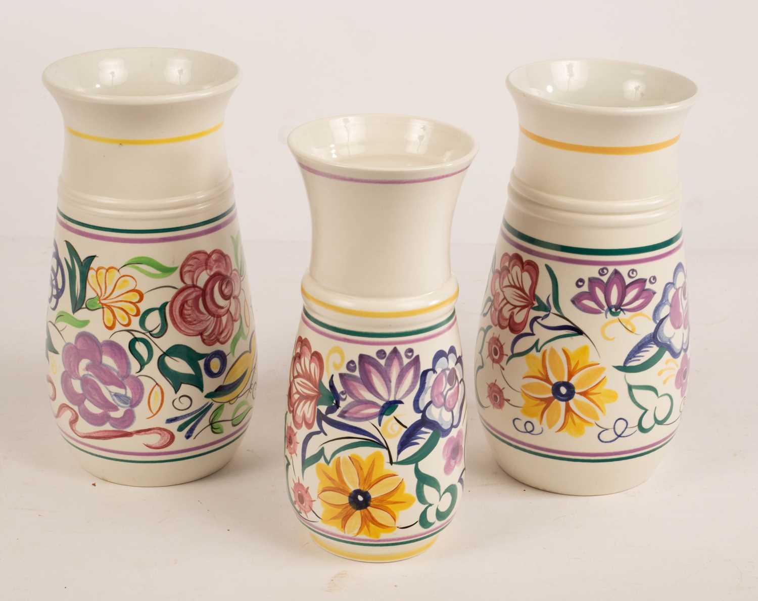 Lot - A pair of Poole floral themed pottery vases together with a Lot - A pair of Poole floral themed pottery vases together with a