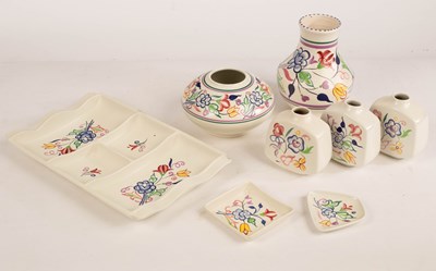 Lot 344 - Poole Pottery, a floral four section hors...