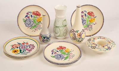 Lot 354 - Poole Pottery, eight floral dinner plates,...