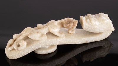 Lot 382 - A Chinese grey jade belt hook, 19th Century,...