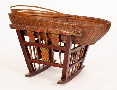 Lot 394 - A Chinese basket crib on a carved, painted and...