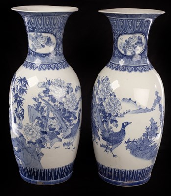 Lot 396 - A pair of blue and white Japanese baluster...