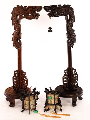 Lot 420 - Two Chinese carved lantern holders, 71cm high