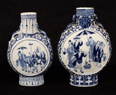 Lot 428 - A near pair of Chinese blue and white vases,...