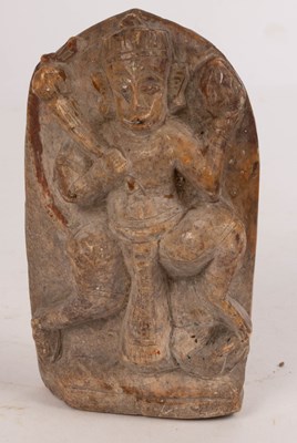 Lot 433 - A tribal stele of Ganesh in polished sandstone,...