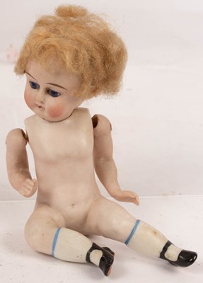 Lot 487 - A French bisque doll with jointed arms, 9cm high