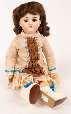 Lot 508 - A bisque head doll with white boots and later...