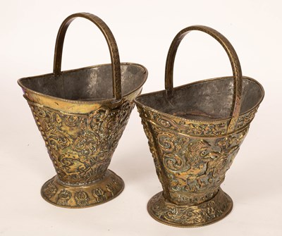 Lot 540 - A pair of embossed brass coal buckets with...