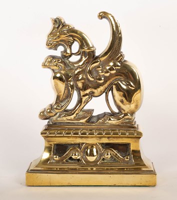 Lot 543 - A brass door stop of griffin form, weighted,...