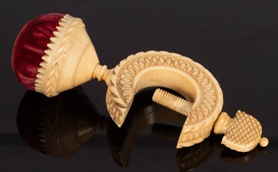 Lot 551 - A carved ivory sewing clamp with pin cushion,...