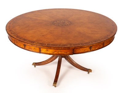 Lot 709 - A large circular dining table by Jonathan...