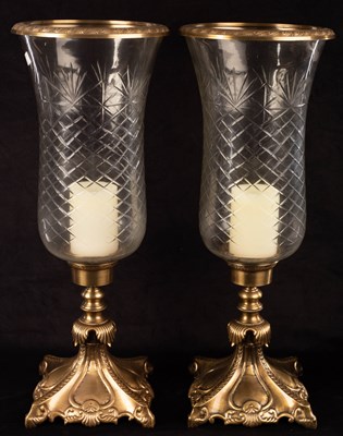 Lot 710 - A pair of cut glass and gilt metal candle...