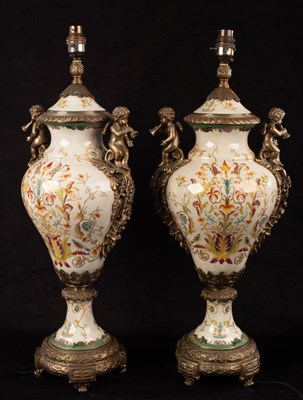 Lot 715 - A pair of vase-shaped pottery lamps with gilt...