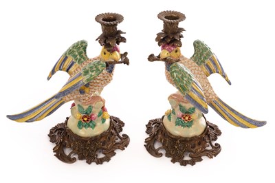 Lot 724 - A pair of candle holders modelled as parrots,...