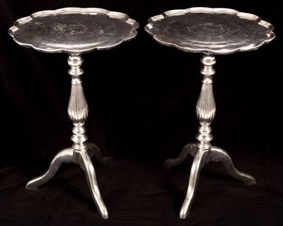 Lot 730 - A pair of metal tripod tables with lobed tops,...